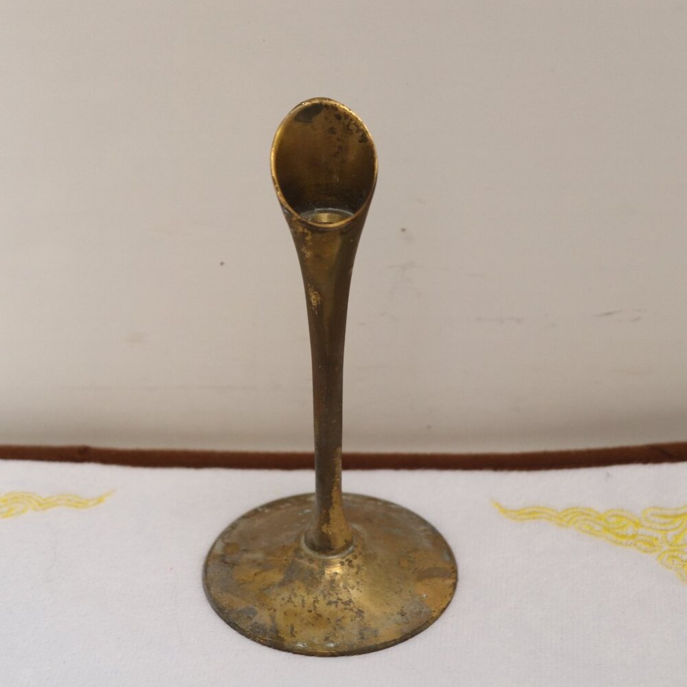 A Brass thing that something screws into it